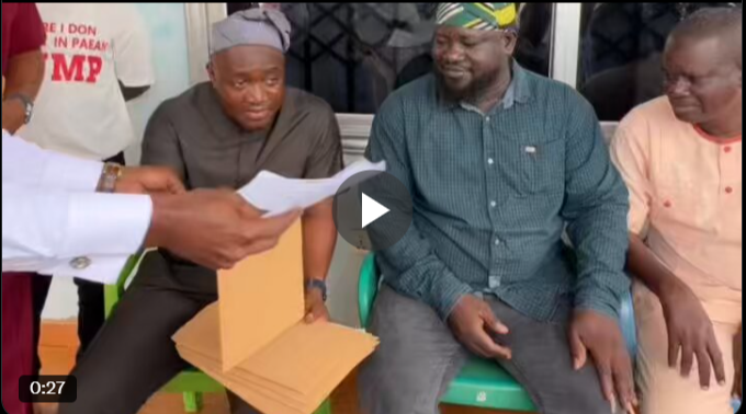 MP Suhuyini presenting appointment letters to his constituents