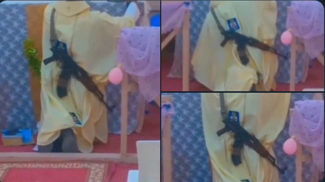 See viral photos of a Catholic Priest in Nigeria captured with an AK-47 during Mass