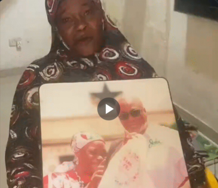 NDC supporter holding a photo with Mahama