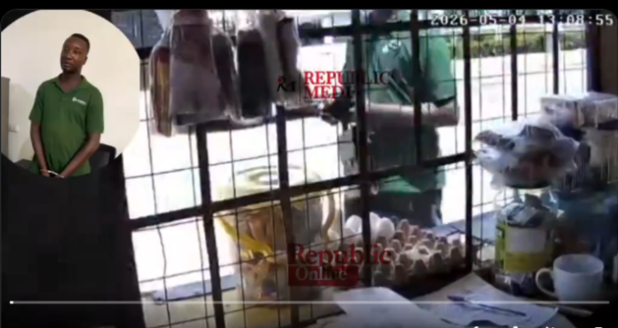 Watch CCTV footage of how a Police Inspector robbed MoMo vendors at gunpoint