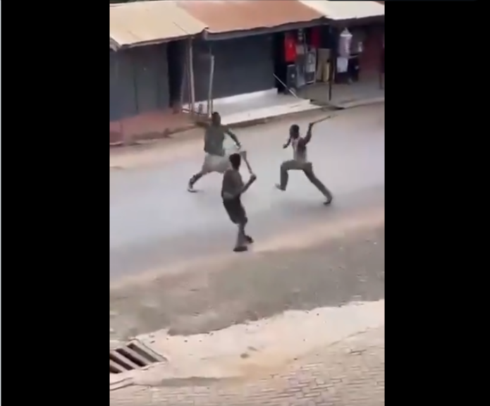 Watch violent clash between three young men wielding machetes