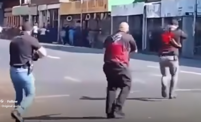White South Africans chase away anti-immigration protesters with gunshots