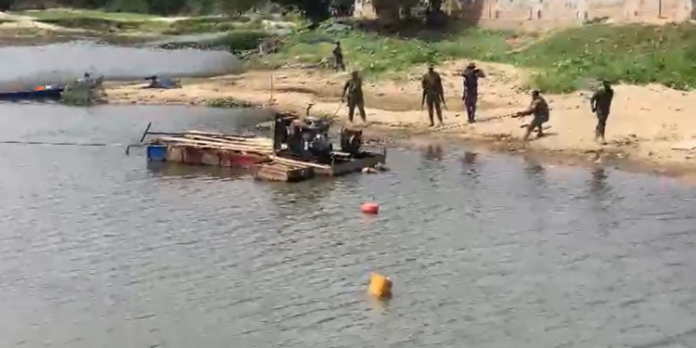 Military officers destroy Changfan machine near Weija dam